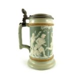 Mettlach, Villeroy and Boch, a third litre stein, relief moulded cameo hunters with boar