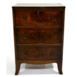 A reproduction mahogany bow fronted chest of three crossbeaded drawers