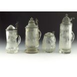 Four cut glass and engraved half and third litre steins