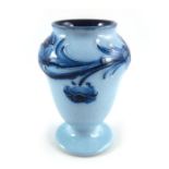 William Moorcroft for James MacIntyre, a miniature Poppy Garland on blue vase