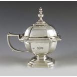L A Crichton, London 1921, a George V Britania silver mustard pot, square chamfered section pedestal
