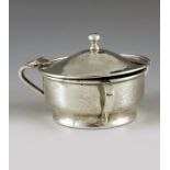 A E Jones, Birmingham 1916, an Arts and Crafts silver mustard pot, planished, three handled squat og