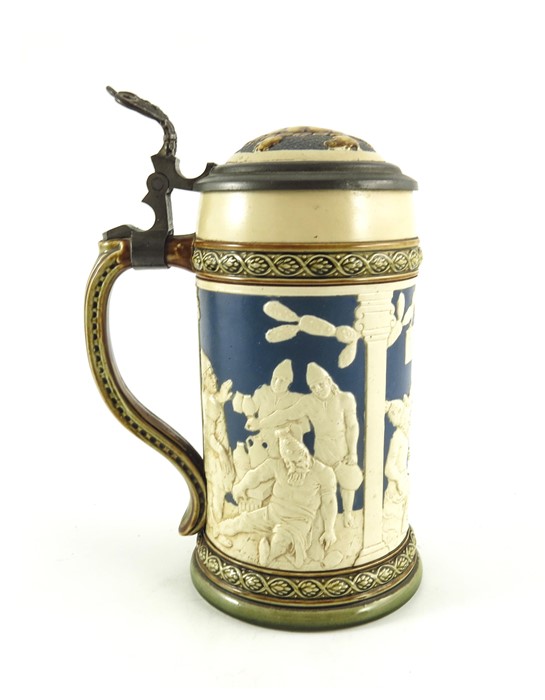 Johann Baptist Stahl for Mettlach, Villeroy and Boch, a half litre stein, relief moulded in the Blac