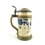 Johann Baptist Stahl for Mettlach, Villeroy and Boch, a half litre stein, relief moulded in the Blac