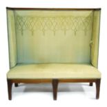 An Art Nouveau and later walnut and silk upholstered settle