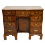 A George I style walnut kneehole desk