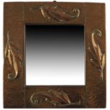 An Arts and Crafts copper mirror