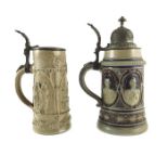 Two relief moulded half litre steins, one with portrait roundels of German Kaisers