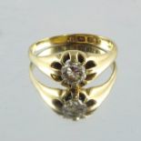 An 18 carat gold diamond solitaire ring