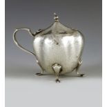 Deakin and Francis, Birmingham 1906, an Arts and Crafts silver mustard pot, planished, lobed ovoid f