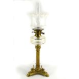 A Victorian brass and glass oil lamp
