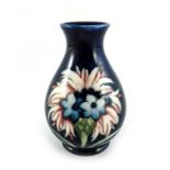 William Moorcroft, a small Late Cornflower on blue vase