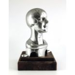 An Art Deco cast white metal mannequin or millinery bust