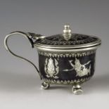 H Sena, Thailand circa 1900, a silver and niello enamel mustard pot, squat beaker form with everted