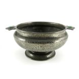 An Arts and Crafts pewter twin handled bowl