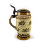 Mettlach, Villeroy and Boch, a half litre stein, incised and jewelled mosaic of leaves and dots