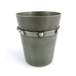 A French Art Deco pewter beaker, in the style of Jean Despres