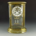 A four glass and brass mantle clock
