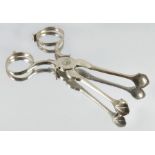 A pair of George II silver sugar nips or tea tongs, Henry Plumpton