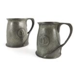 Oliver Baker for Liberty and Co., two Tudric pewter golf trophy tankards