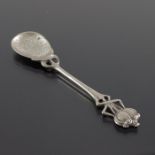 An Arts and Crafts silver plated condiment or tea spoon, in the Glasgow style of Archibald Knox