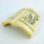 A 19th century carved ivory wrist rest, modelled as an open book