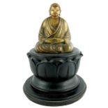 A gilt wood figure of Buddha, 19th century or earlier