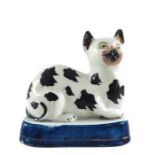 A Staffordshire pottery figure of a cat