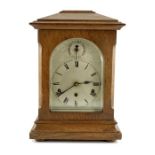 A large 1930s Continental oak cased mantle clock