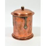 A E Jones, an Arts and Crafts copper and silver overlay tea caddy
