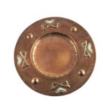 An Arts and Crafts copper and white metal dish