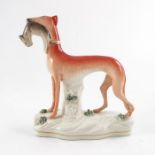 A Staffordshire figure of a greyhound,