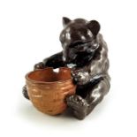 Mark V Marshall (attributed) for Doulton Lambeth, a stoneware bear, modelled as a seated bear with a