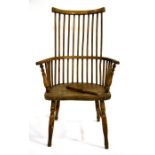 A vernacular elm and ash comb back armchair