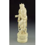 A 19th century Indian carved ivory figure of Krishna