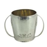 Archibald Knox for Liberty and Co., an Arts and Crafts silver twin handled cup