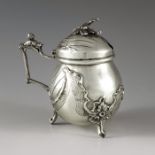Unknown, Belgium, circa 1890, a Belgian silver mustard pot and spoon, ovoid form, embossed with Roco