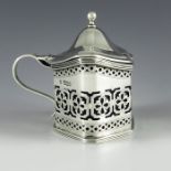 Nathan and Hayes, Chester 1901, an Edwardian silver mustard pot, oval section squat baluster boat fo