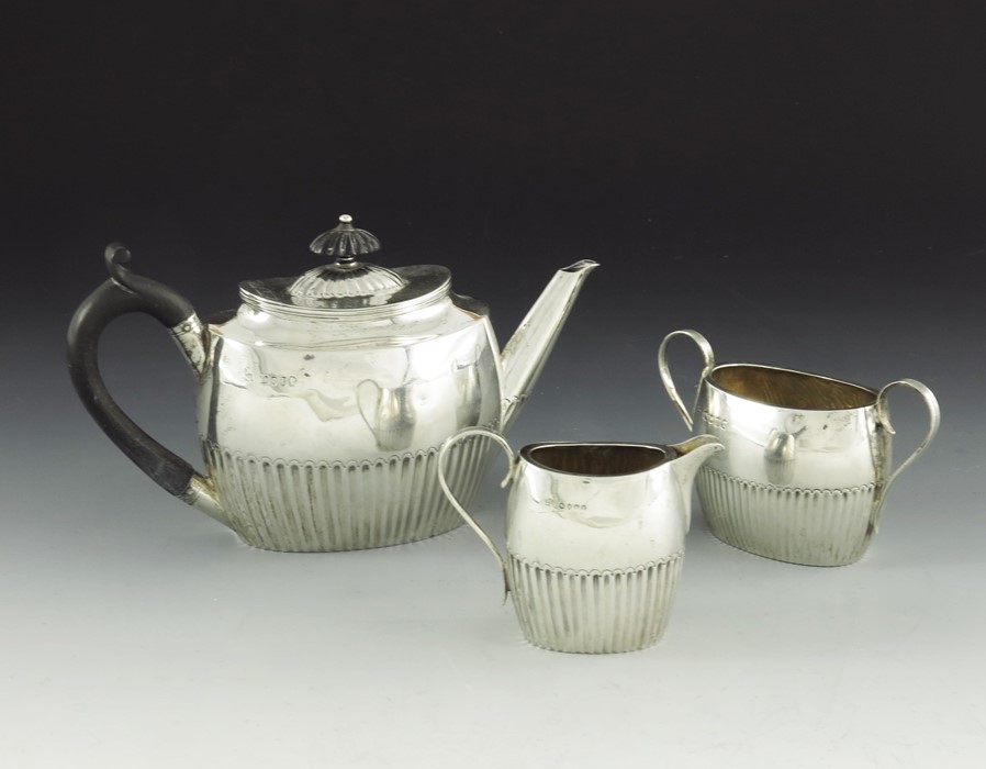 A Victorian silver bachelors three piece tea set, William Hutton and Sons - Image 3 of 3