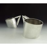 A pair of Art Deco white metal vessels