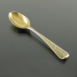 A George II silver gilt picture front teaspoon, London circa 1740
