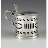 Charles Stuart Harris, London 1924, a George V silver mustard pot, cylindrical form reticulated and