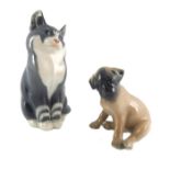 A Royal Copenhagen figure of a cat, number 1803, together with a pug dog