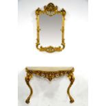 An 18th century style gilt gesso and carved wood pier glass and console table