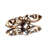 A 9 carat gold and garnet brooch