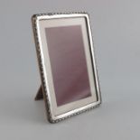 A George V silver photo frame, Charles S Green and Co