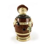 J Reinemann, a novelty half litre character stein, in the form of a man in a barrel