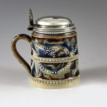 Frank Butler for Doulton Lambeth, Birmingham 1874, a silver mounted stoneware mustard pot, conical f