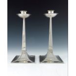 A pair of Arts and Crafts silver candlesticks, James Dixon and Sons, Sheffield 1916