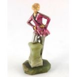 An Art Deco cold painted and resin figure of a dancer kneeling on a plinth, circa 1925